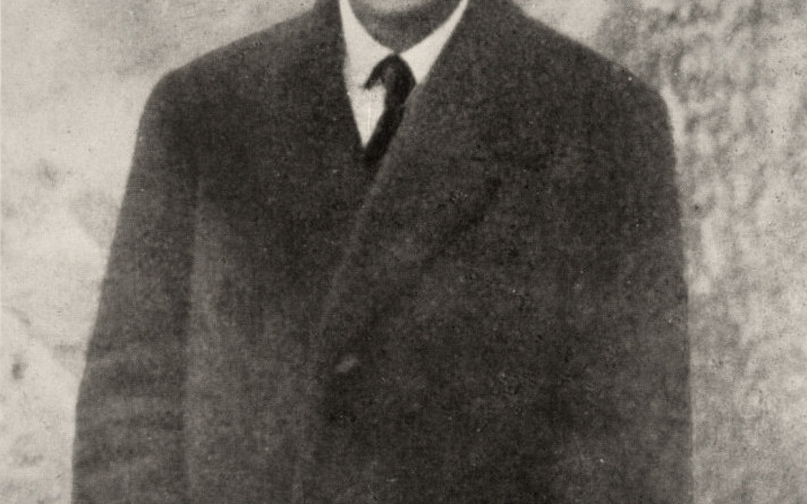Black-and-white portrait photograph of Franz Kafka, Prague, circa 1917, three-quarter profile against a plain studio ground